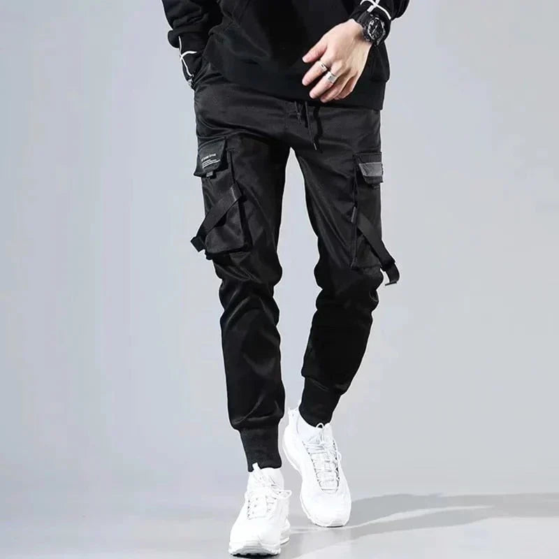 Versatile men's black hip-hop cargo pants, multi-pocket design for comfort and streetwear style.