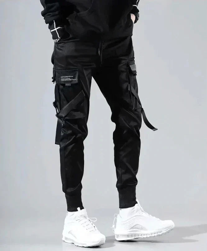 Black cargo pants for men by Dante. Multi-pocket, hip-hop, streetwear, and athletic casual wear.