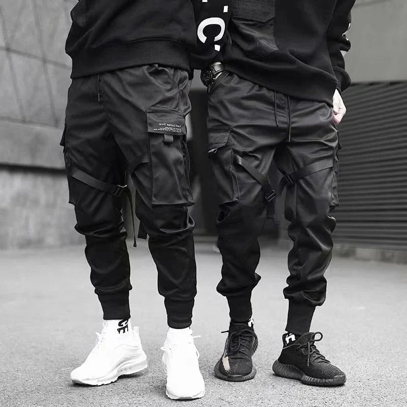 Athletic yet casual, Dante black multi-pocket cargo pants for men. Urban hip-hop streetwear style.