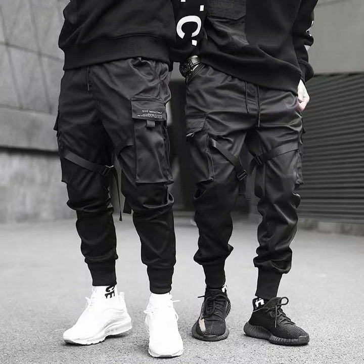Athletic yet casual, Dante black multi-pocket cargo pants for men. Urban hip-hop streetwear style.