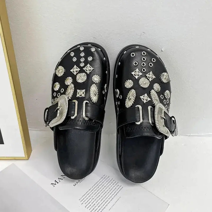 Black studded platform sandals for women, offering an edgy style & comfortable fit.