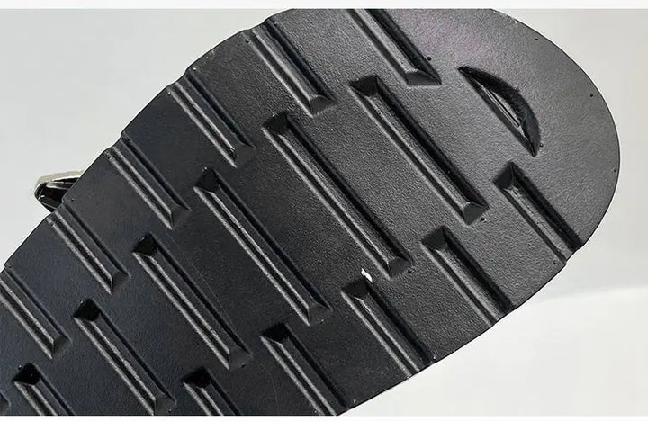 Front view of women's black platform sandals, featuring eye-catching stud embellishments.