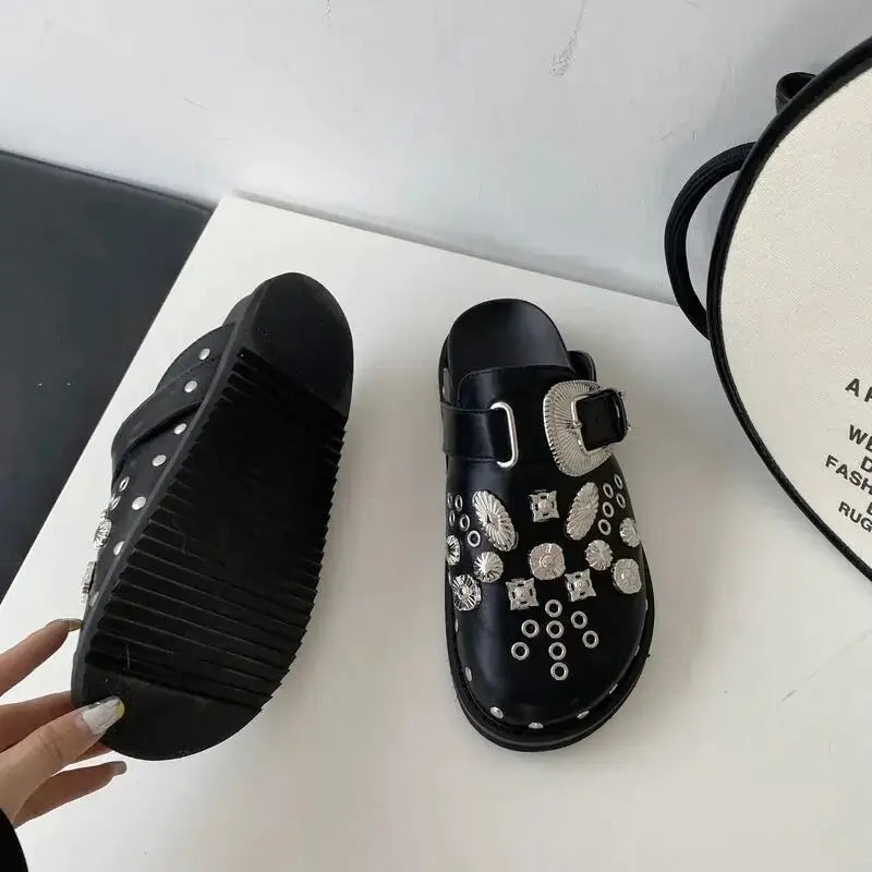 Women's edgy black platform sandals, detailed with stylish silver studs for a bold look.