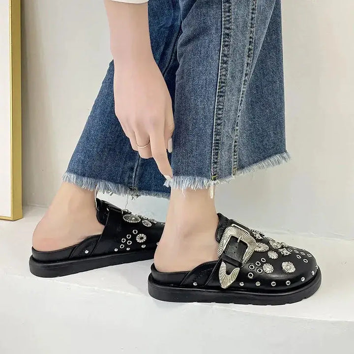 Comfortable & edgy women's black studded platform sandals, perfect for making a fashion statement.