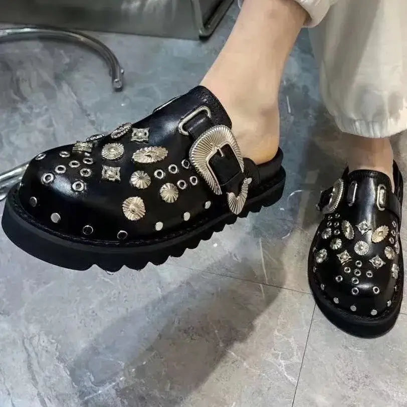 Side profile of women's black studded platform sandals, highlighting the high sole & edgy design.