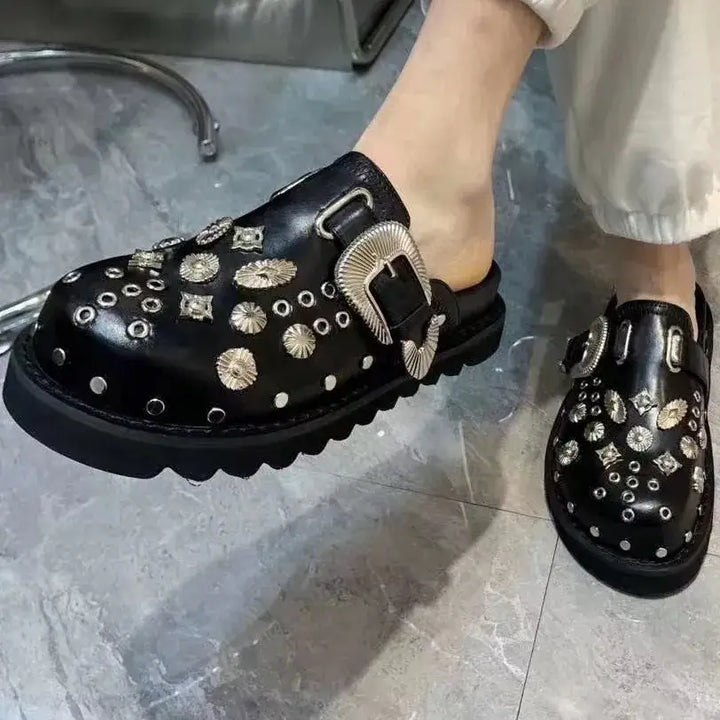Side profile of women's black studded platform sandals, highlighting the high sole & edgy design.
