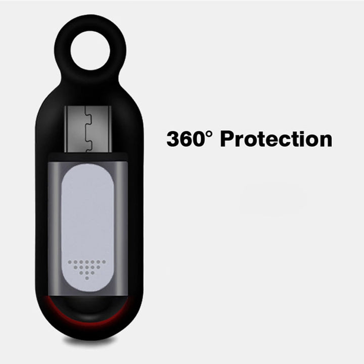 Hand holding a smartphone with the attached black universal IR remote control for convenient operation