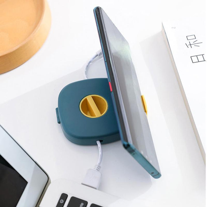 Close-up of the ABS material universal cable winder & phone stand in blue, highlighting texture and design.