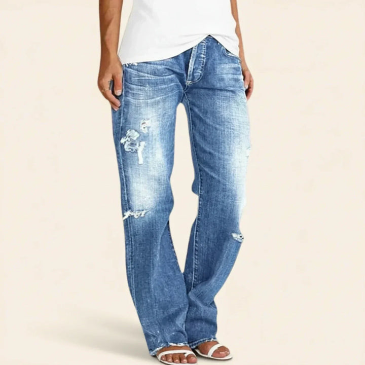 Distressed black women's high waist straight leg pants with a relaxed fit for modern fashion.