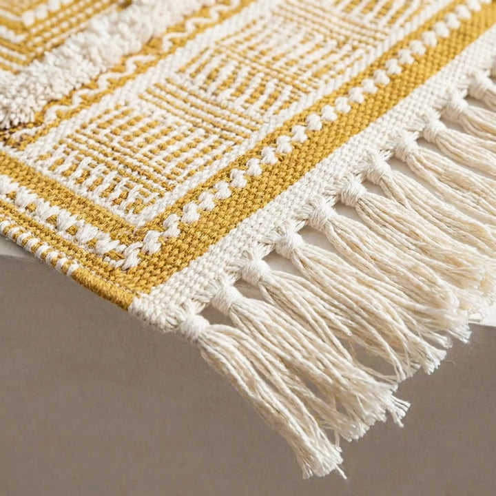 Elegant bohemian fringed area rug featuring a subtle wave pattern. Versatile for living room, bedroom, entryway decor.