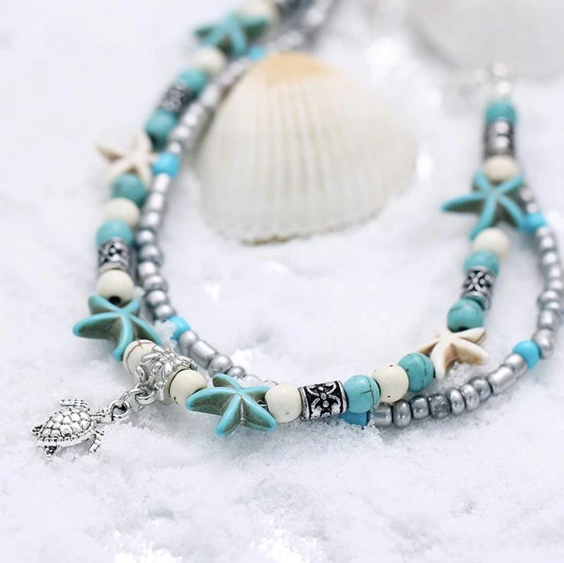 Bohemian inspired sea turtle anklet, showcasing intricate craftsmanship and beachy vibes.