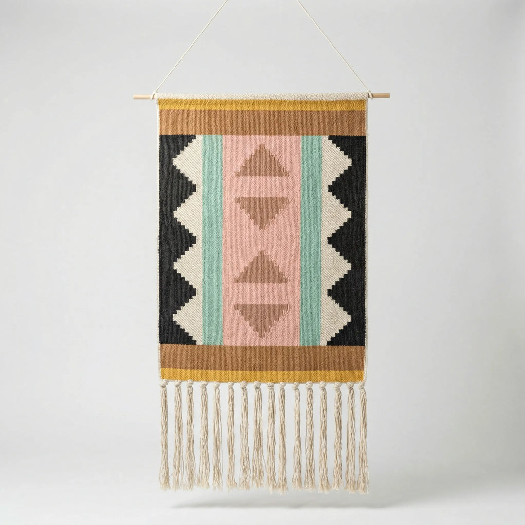 Textured Boho wall hanging featuring modern geometric wave patterns & delicate fringe. Flowique design.