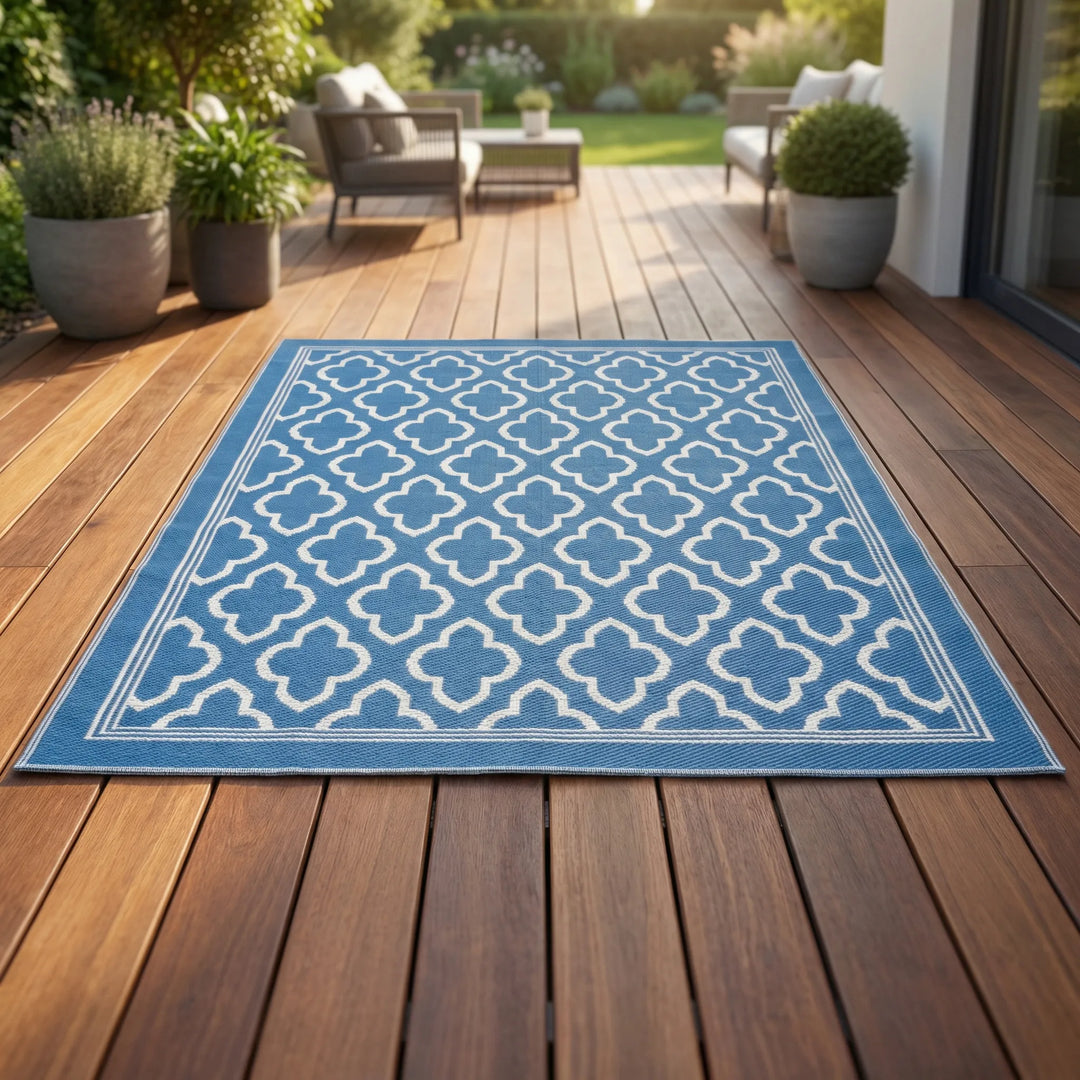 Boho outdoor area rug with an elegant wave pattern, perfect for patios. Weather-resistant and easy to clean.