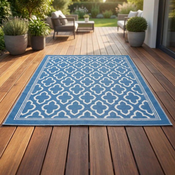 Boho outdoor area rug with an elegant wave pattern, perfect for patios. Weather-resistant and easy to clean.