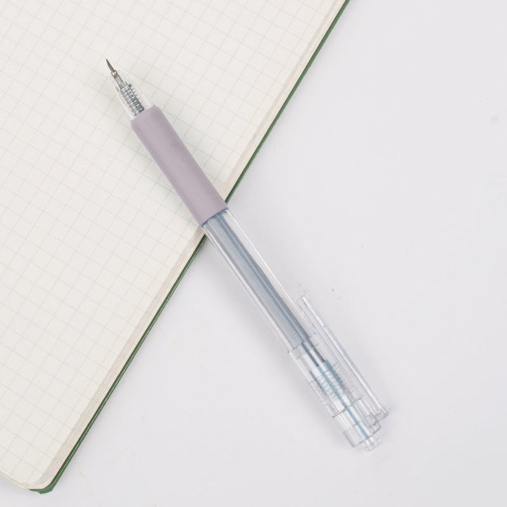 Close-up of a cartoon cat glue pen, fine tip for detailed application in student art & craft