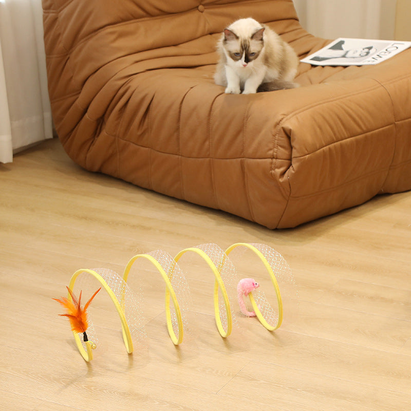 Cat exploring an interactive foldable tunnel with playful feathers, promoting exercise & fun for felines.