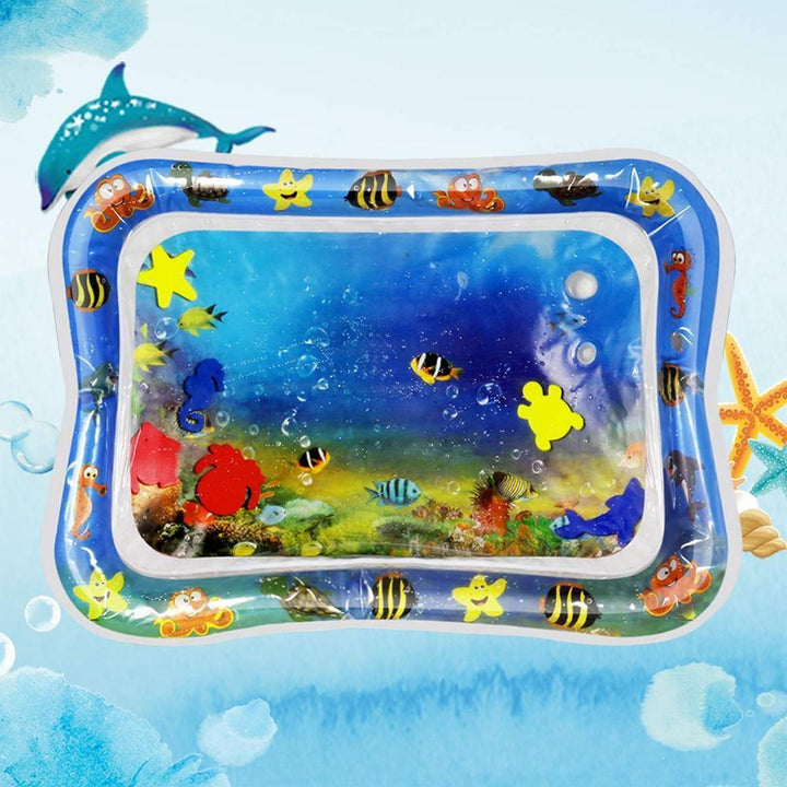 Top-down view of a cat's paws dipping into the blue water of the pet play mat, engaging in sensory play