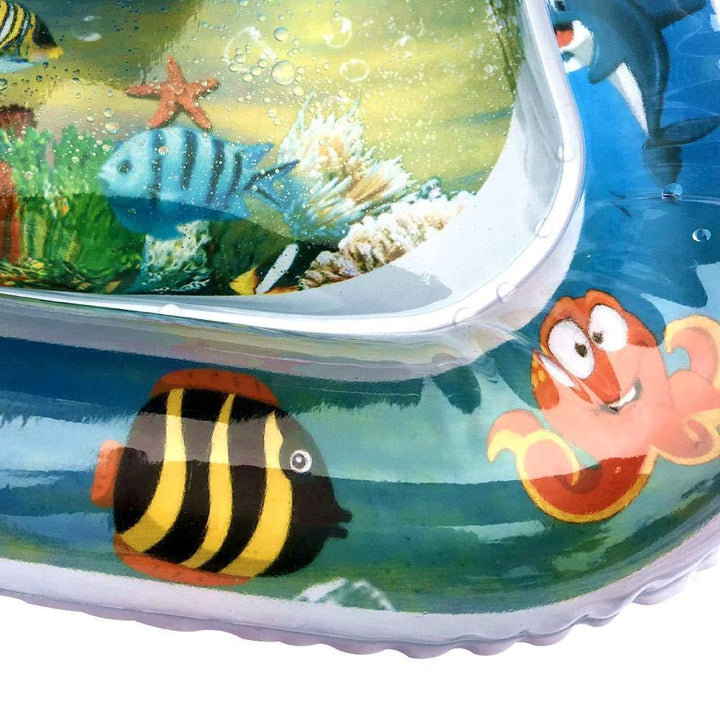 A cat batting at a floating toy on a water-filled play mat, promoting engaging sensory play