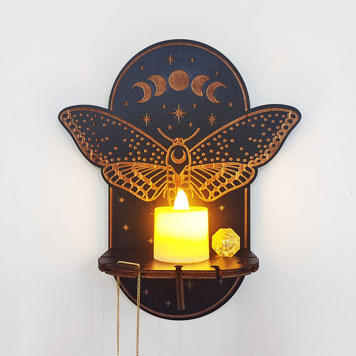 Ornate celestial altar shelf with crystal display and pendulum hanging, a spiritual home artwork