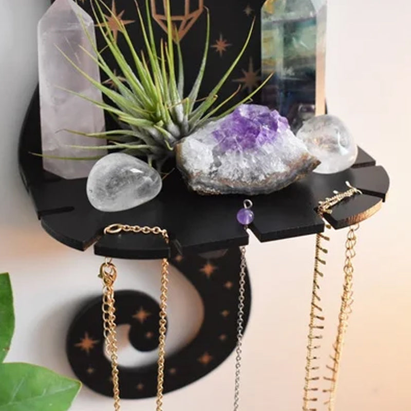 Close-up of a celestial wooden shelf holding an array of crystals, ideal for spiritual practice
