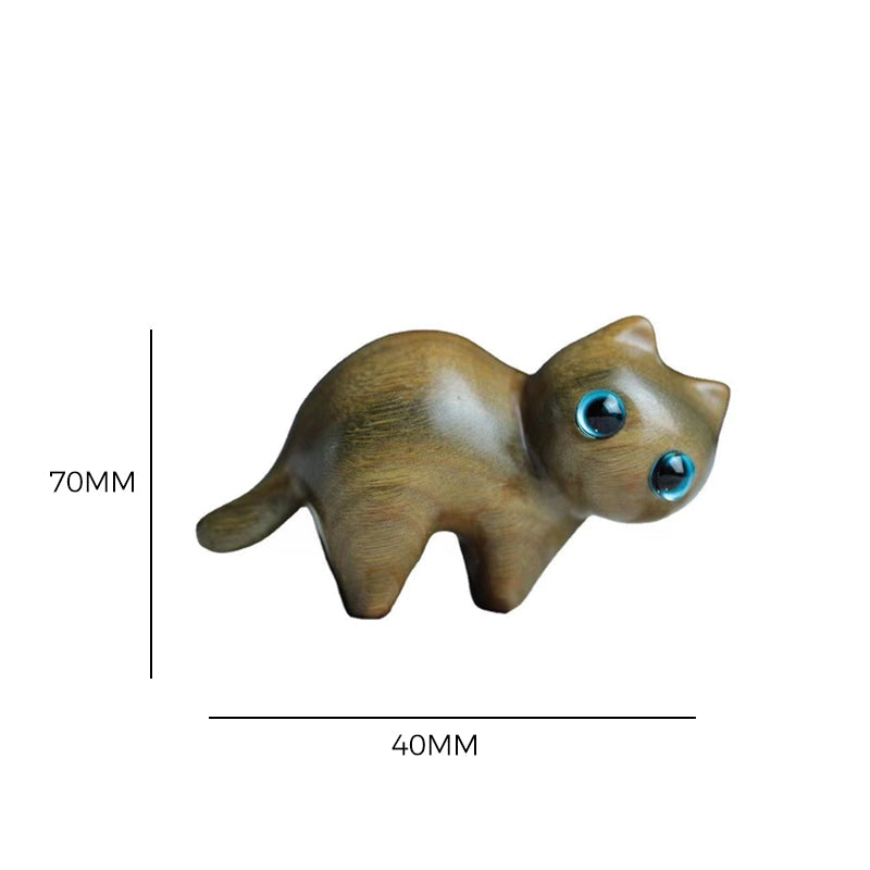 Cute cat figurine, hand-carved from wood, showcasing intricate craftsmanship
