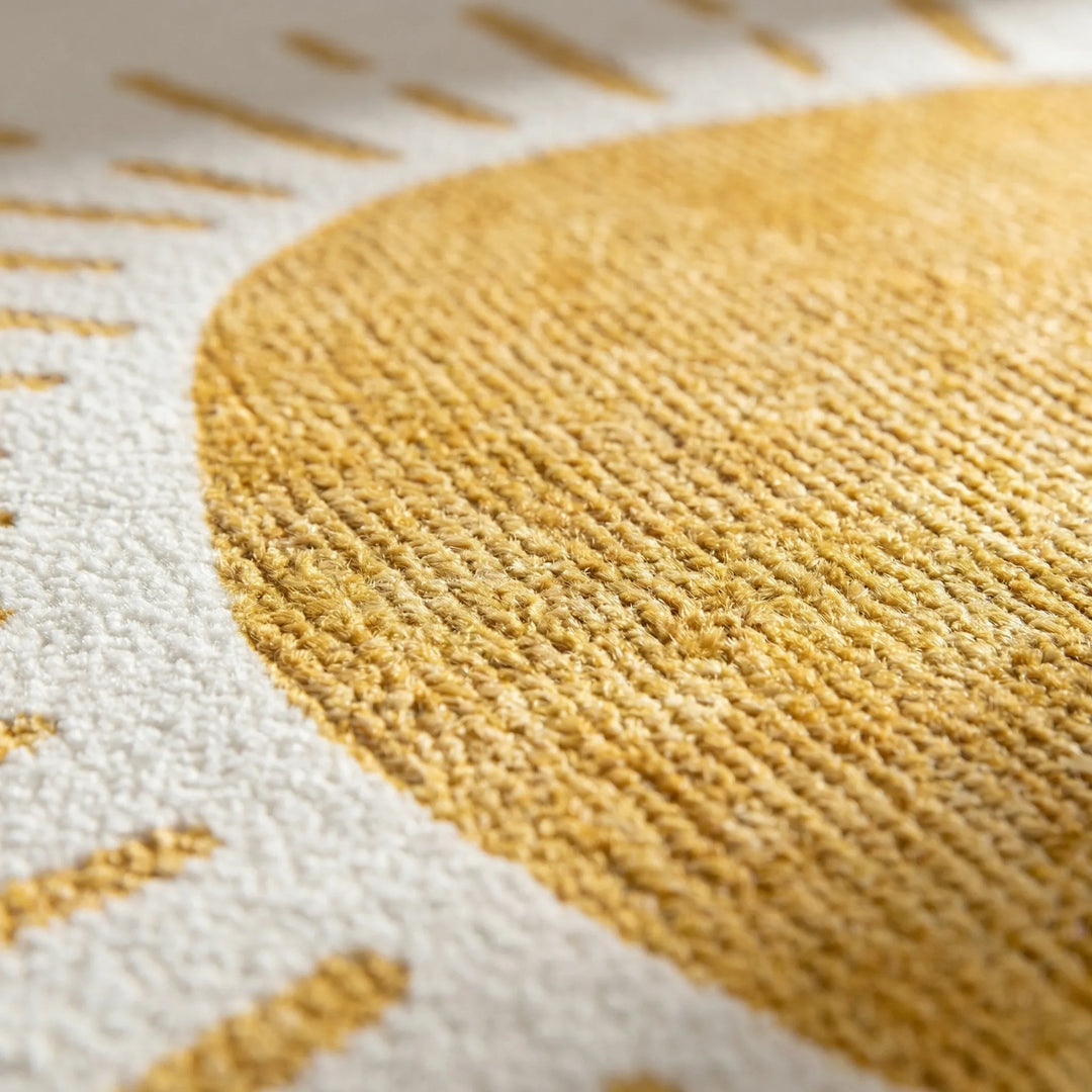 Washable round area rug with a charming sun motif. Non-slip Flowique design perfect for any cozy home decor.