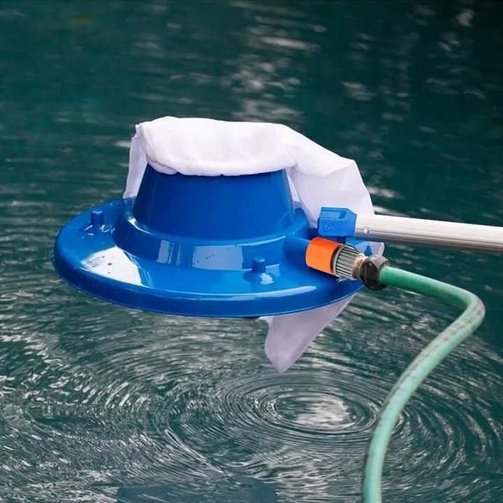 Eco-friendly pool cleaner attached to a garden hose, demonstrating powerful debris suction.