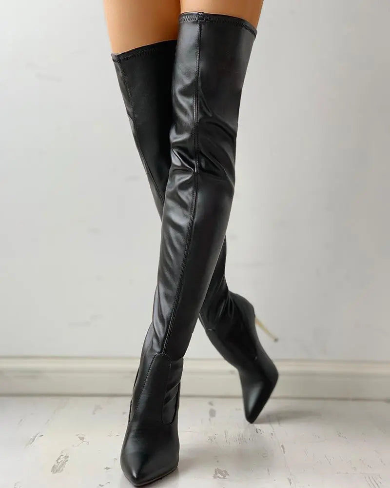 Chic black women's knee-high boots with low heel & zip, perfect for comfortable fall & winter casual or formal wear.