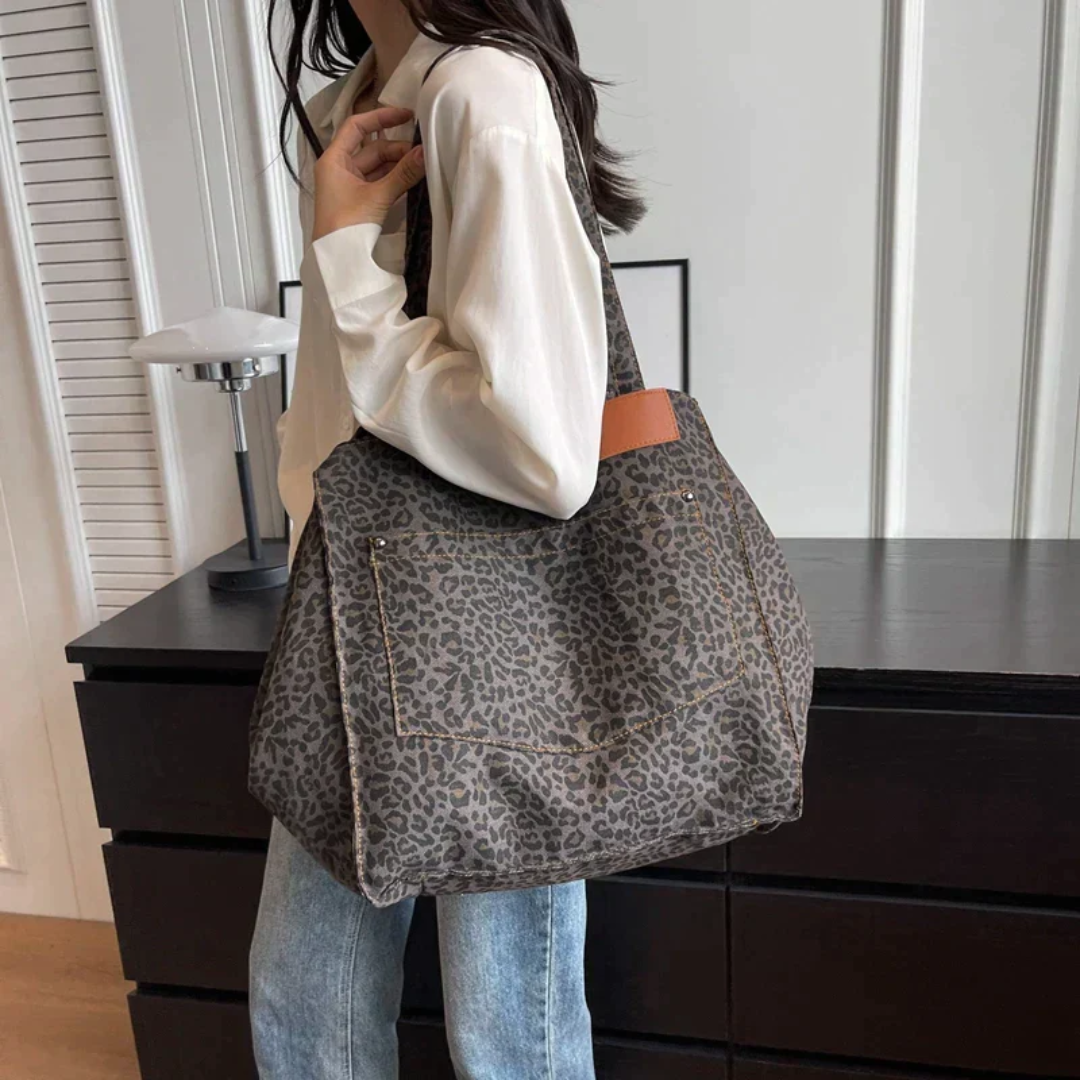 Fashionable women's leopard print shoulder bag. Black & brown animal print handbag with a designer quality look.