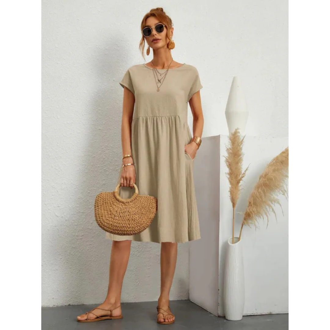 Comfortable women's cap sleeve A-line midi dress with convenient pockets, ideal for effortless summer style.