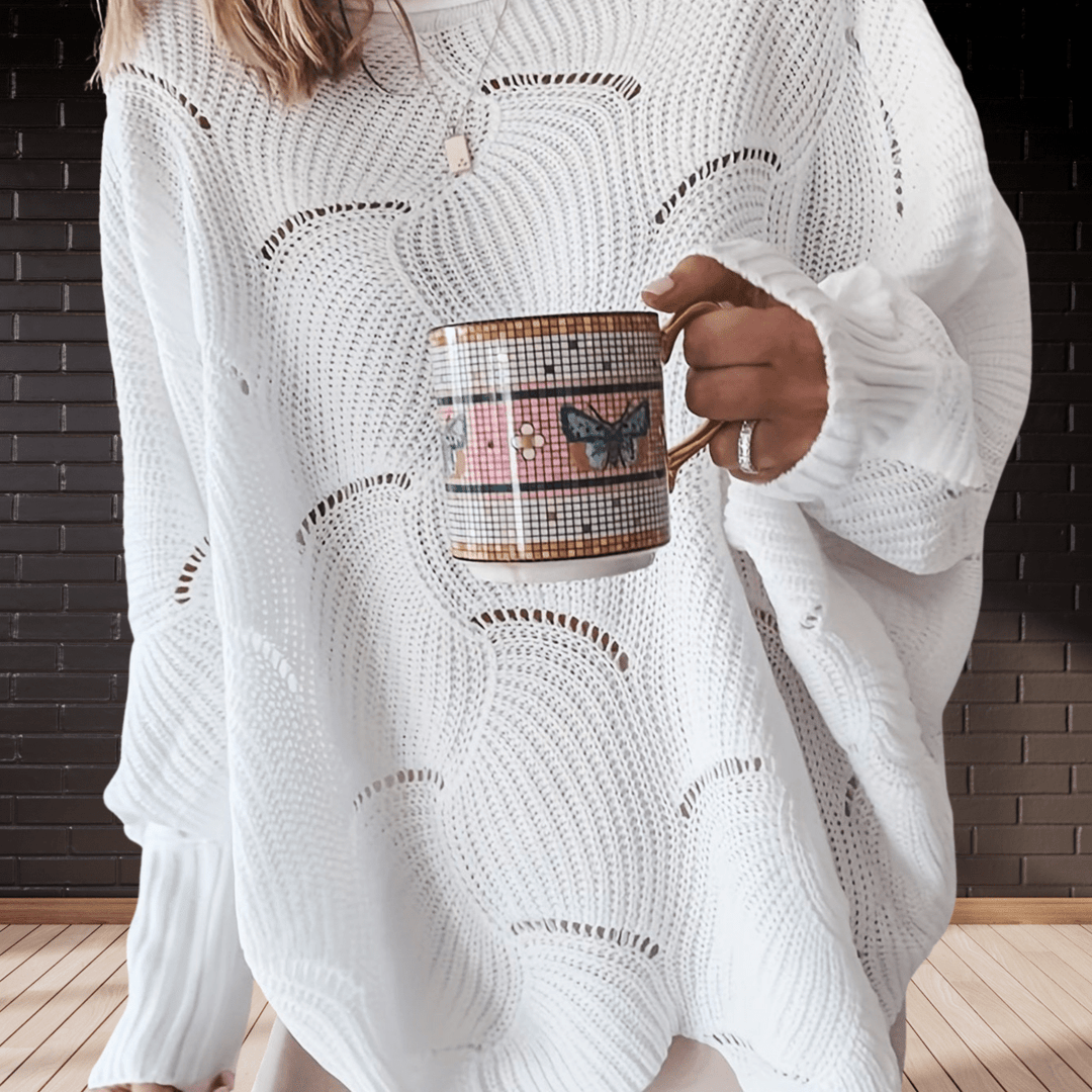 Chic women's autumn ribbed knit jumper with an asymmetric hem. Cozy, long-sleeve sweater for fall fashion.
