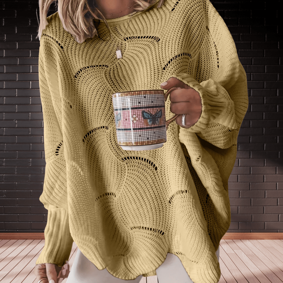 Plus size women's autumn ribbed knit jumper. Comfortable, relaxed fit sweater with an asymmetric hem for fall.