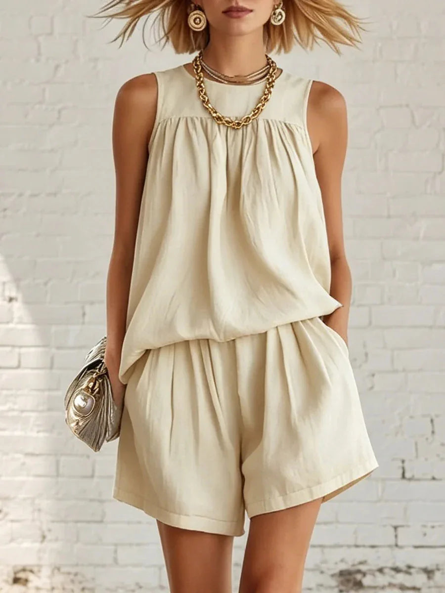 Chic women's casual gathered sleeveless top & high-waisted shorts set. Perfect two-piece summer outfit.