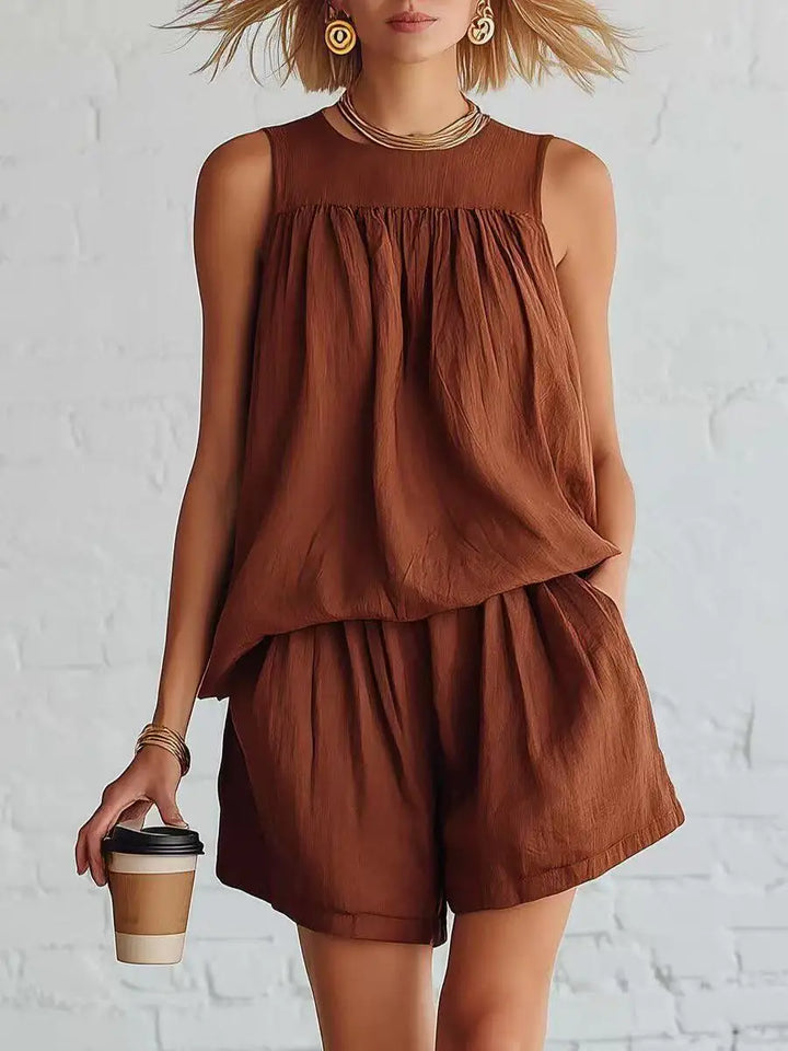 Women's casual daywear shorts set with a gathered sleeveless top & high-waisted shorts. Comfortable summer outfit.