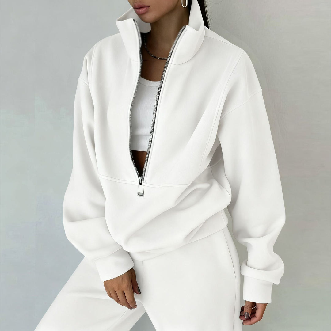 Fashionable women's chic half-zip pullover & jogger set. Modern two-piece athleisure for stylish comfort.