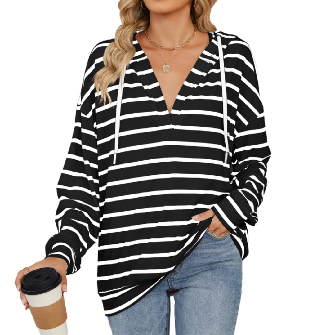 Chic women's hoodie with a flattering fit, perfect for everyday casual wear. Comfortable long sleeve pullover.