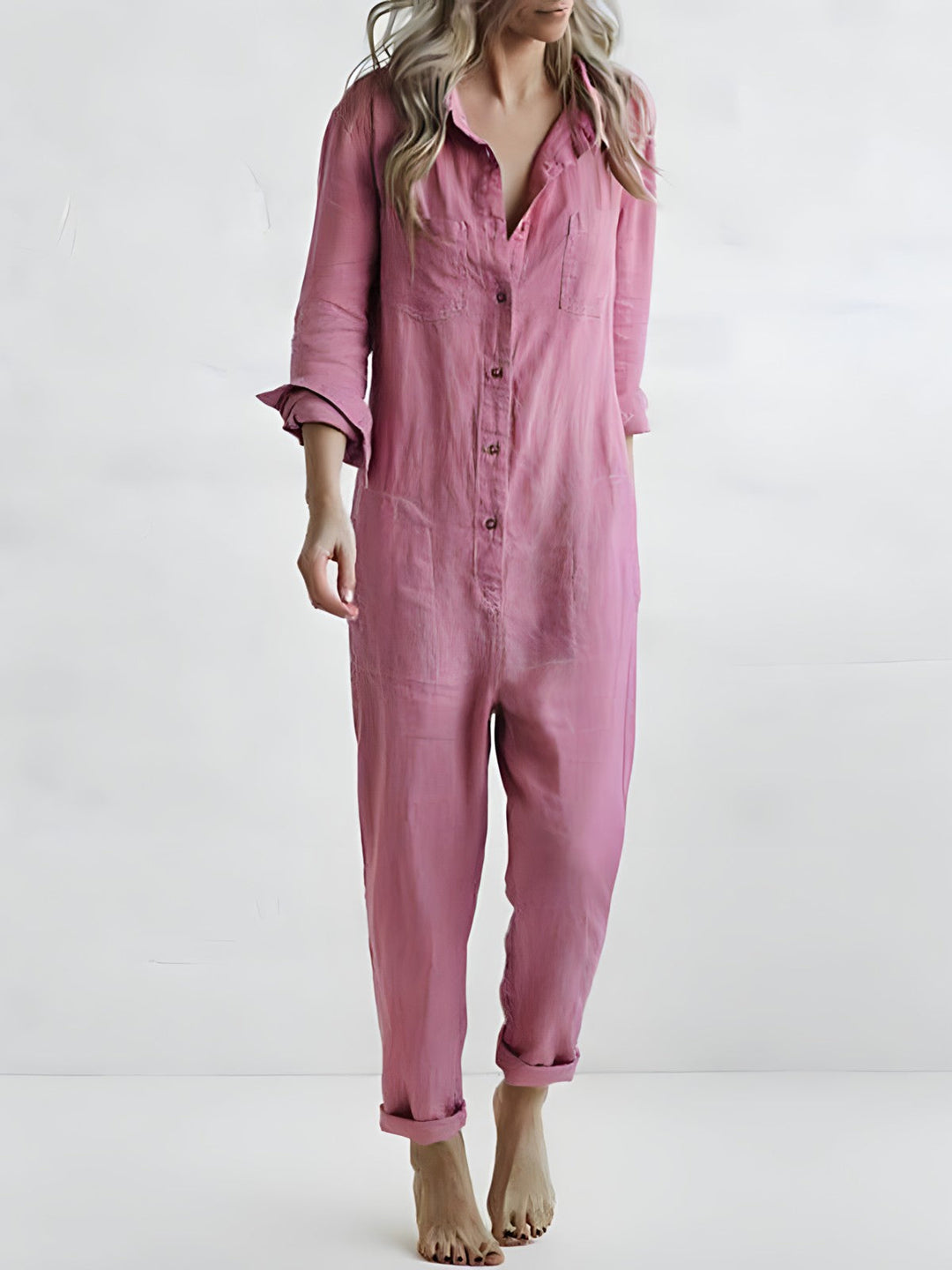 Chic women's long sleeve button jumpsuit in a flattering fit, perfect for versatile day-to-night casual elegance.