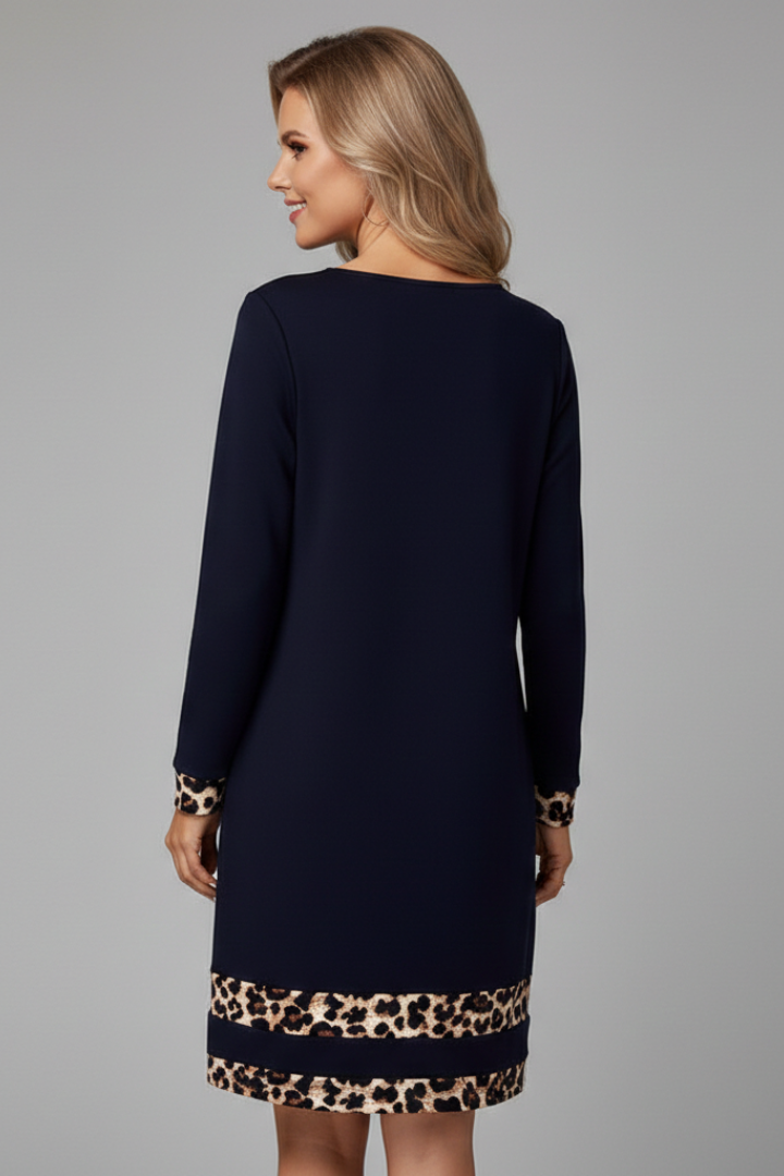 Elegant women's short dress, long sleeve, featuring a unique patterned hem and classic round neck design.