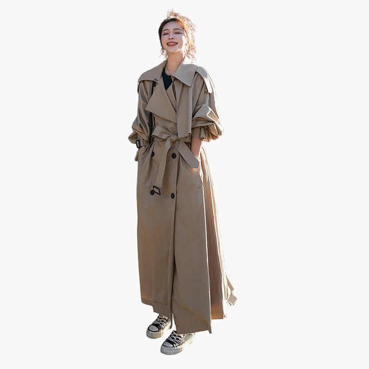 Oversized double-breasted trench coat for women, long and loose-fitting, a stylish fashion outerwear piece.