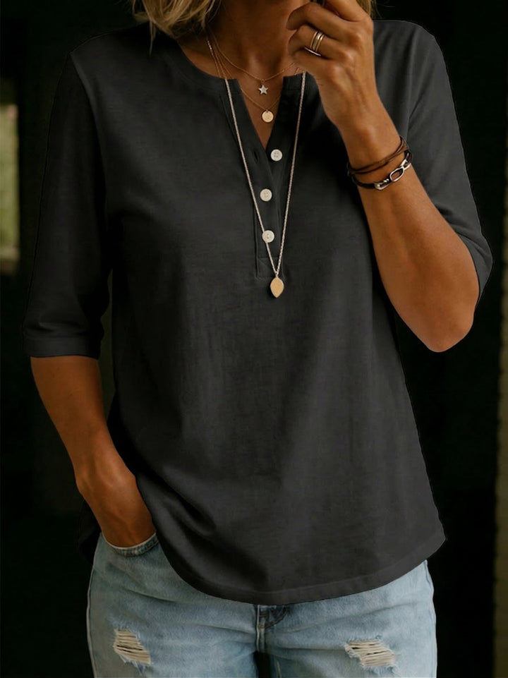 Stylish women's 3/4 sleeve relaxed blouse, showcasing the fabric texture and classic notch neck design.