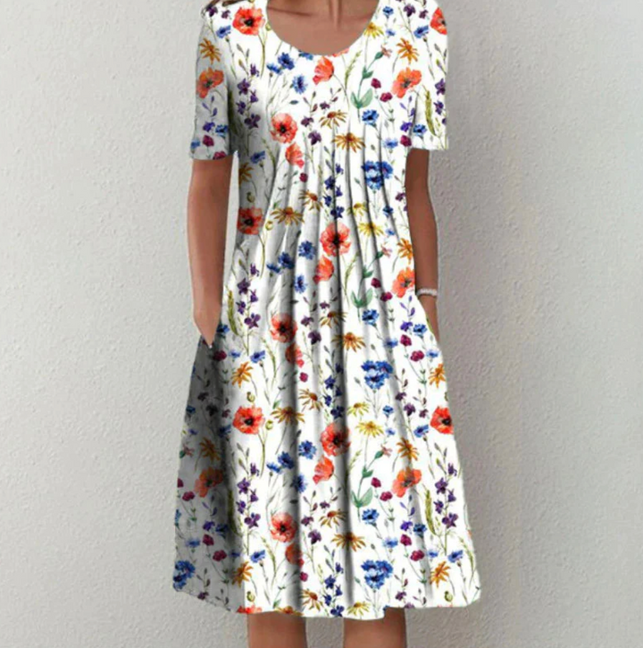 Chic women's printed A-line midi summer dress with pleats, perfect for casual wear or vacation.