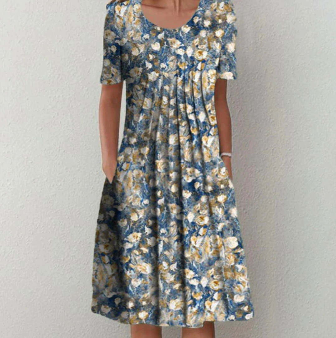 Bohemian style women's printed summer dress, A-line cut with pleats, perfect for vacation or warm weather.