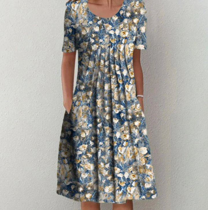Bohemian style women's printed summer dress, A-line cut with pleats, perfect for vacation or warm weather.