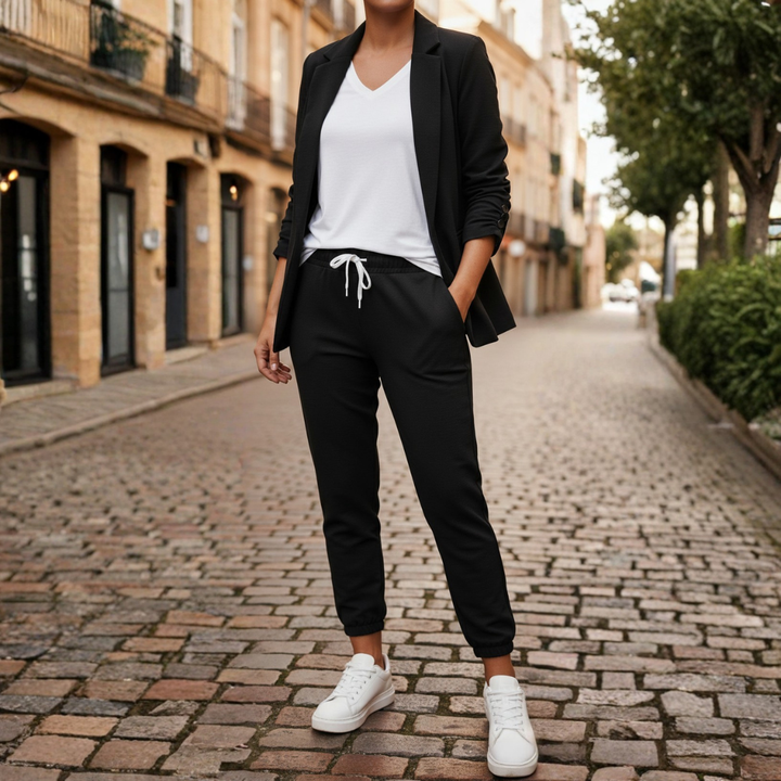 Chic women's lounge set: ruched sleeve blazer and soft jogger pants. Comfortable & stylish two-piece outfit.