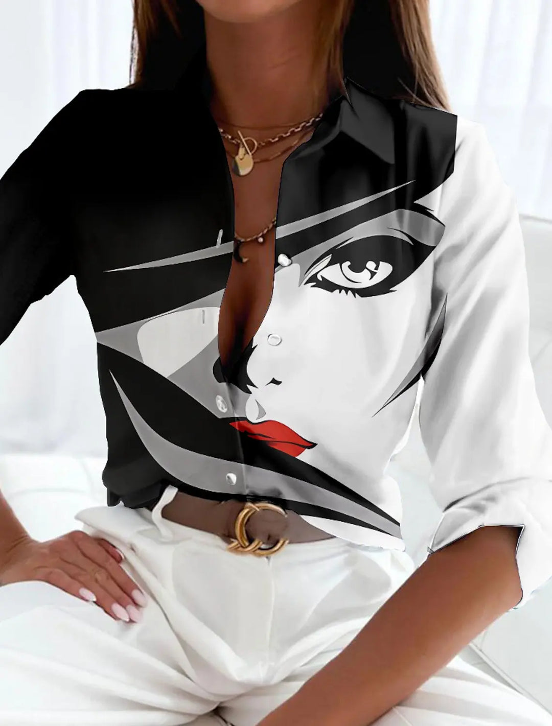Women's fashion top with vibrant abstract print & short sleeves, suitable for casual or work style.