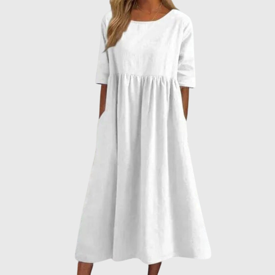 Chic women's short-sleeved dress, versatile for casual or elegant style. Flattering fit, perfect for summer.