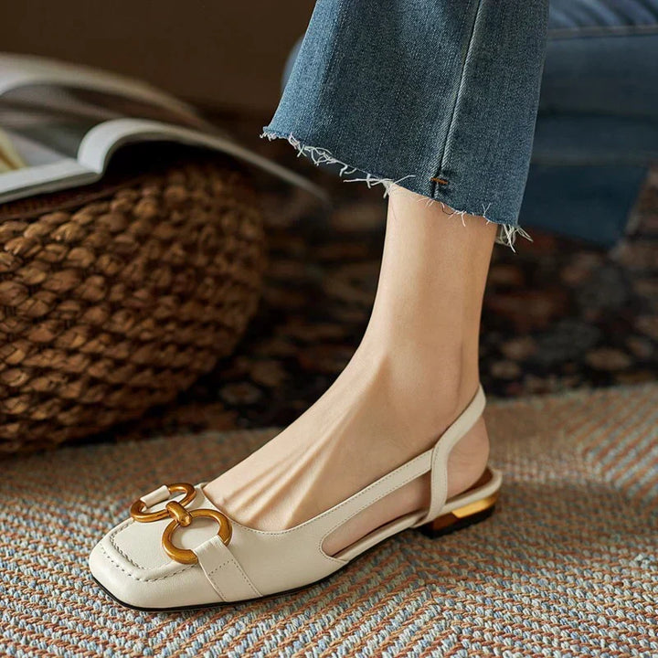 Versatile brown ladies' slingback flats with a comfortable ergonomic design, ideal for everyday elegance.