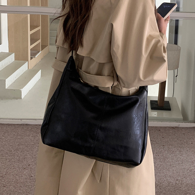 Close-up of PU Leather Texture on Women's Solid Crossbody Shoulder Bag