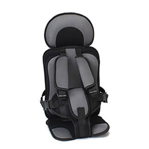 Kids' travel car seat booster with safety harness & durable cover for secure & cozy rides.