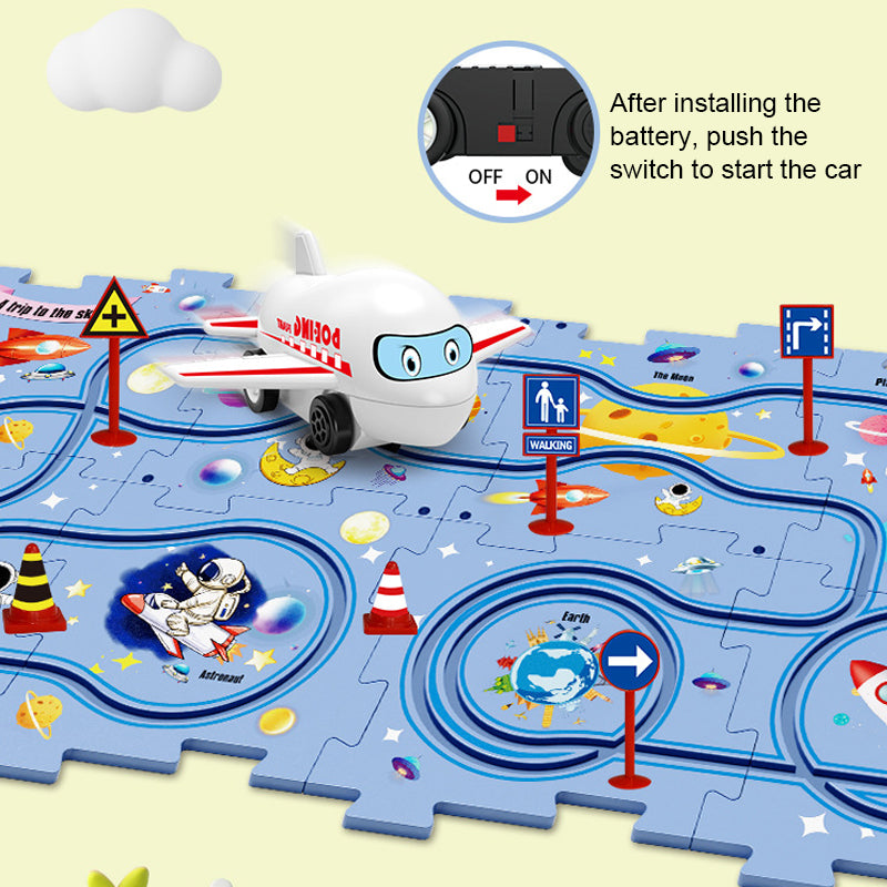 Close-up of a child's hand placing a track piece for the educational track car play set